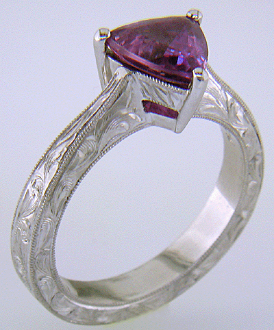 Hand-engraved platinum ring with a trillium purple sapphire. (J8732)