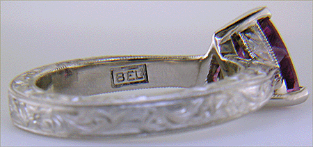 Close-up of Bijoux Extraordinaire (BEL) hallmark.