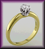 18kt gold tulip-set engagement ring with solitaire diamond.
