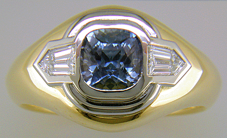 Custom Sapphire and Diamond ring crafted in 18kt gold and platinum.