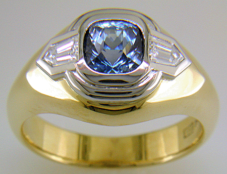 Custom Sapphire and Diamond ring crafted in 18kt gold and platinum.