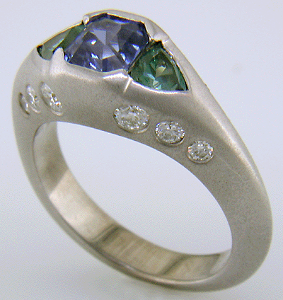 Sapphire and green tourmalines in a custom white gold ring.