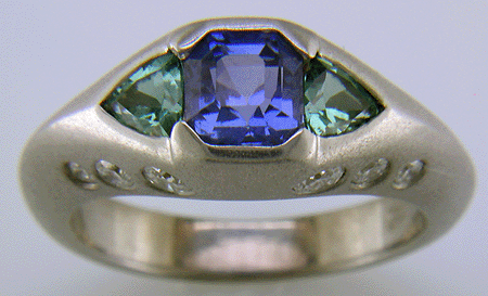 Sapphire and green tourmalines in a custom white gold ring.