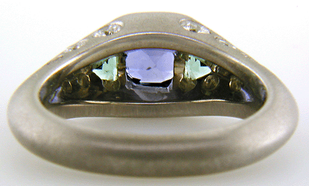 Inside view of a sapphire and green tourmaline white gold ring.