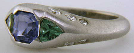 Sapphire and green tourmalines in a custom white gold ring.