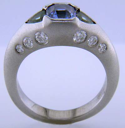 Sapphire and green tourmalines in a custom white gold ring.