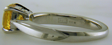 Close up of Bijoux Extraordinaire hallmark ('BEL') and precious metal marks.