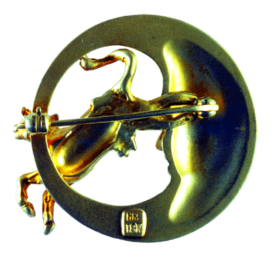 Rear view of cow over the moon brooch.