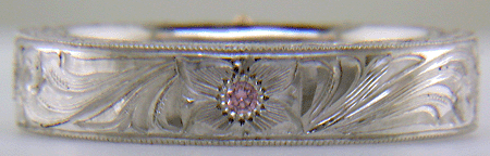 Hand engraved platinum ring with pink diamonds. (MEZA1193)