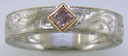 Hand engraved platinum ring with pink diamonds. (MEZA1193)