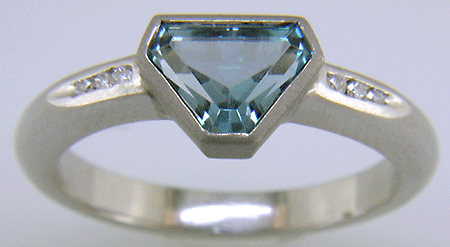 Calf-head Aquamarine with round diamonds in a custom platinum ring.