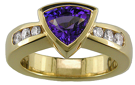 Trillium-cut tanzanite set with graduated diamonds in an 18kt gold ring.