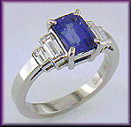 Emerald cut sapphire and diamond handcrafted platinum ring.