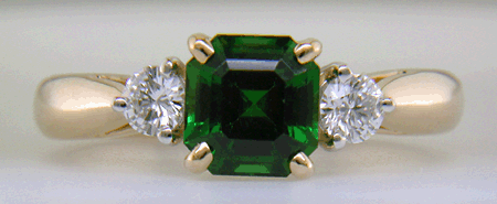 Emerald-cut Chrome Tourmaline set with two round diamonds in a handcrafted 18kt gold and platinum ring.