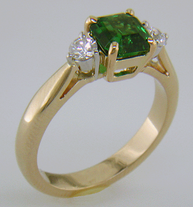 Emerald-cut Chrome Tourmaline set with two round diamonds in a handcrafted 18kt gold and platinum ring.