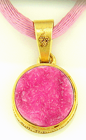 Drusy cobaltocalcite set in a 22kt gold pendant.