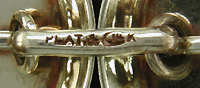 Close-up of precious metal and maker marks.