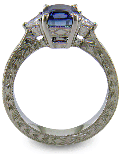 Cushion Sapphire ring with trilliant diamond and hand engraved platinum. (J8750)