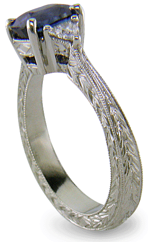 Cushion Sapphire ring with trilliant diamond and hand engraved platinum. (J8750)