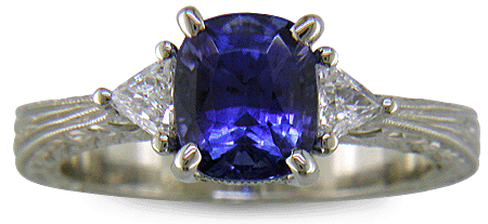 Cushion Sapphire ring with trilliant diamond and hand engraved platinum. (J8750)