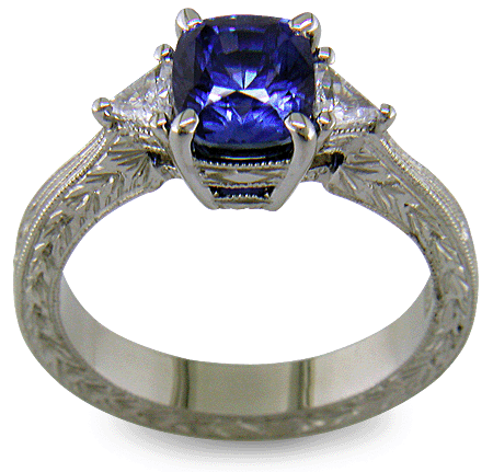 Cushion Sapphire ring with trilliant diamond and hand engraved platinum. (J8750)