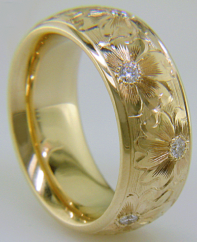 Hand engraved yellow gold band with diamonds