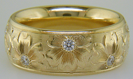 Hand engraved yellow gold band with diamonds