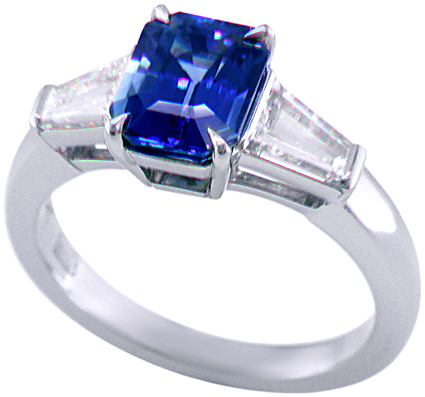 Emerald-cut Sapphire with tapered baguette diamonds in a custom platinum ring. (J8643)