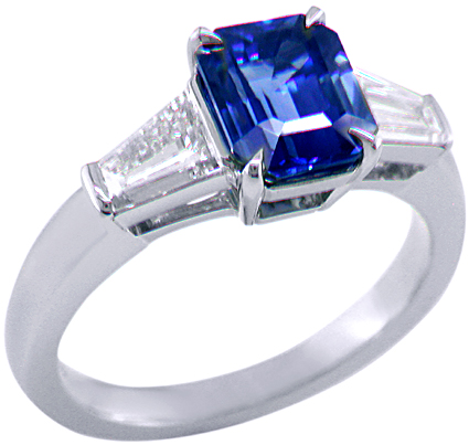 Emerald-cut Sapphire with tapered baguette diamonds in a custom platinum ring. (J8643)