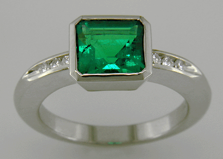 1.6-carat emerald set with round brilliant-cut diamonds in a custom platinum ring.