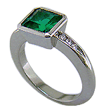 1.6-carat emerald set with round brilliant-cut diamonds in a custom platinum ring.