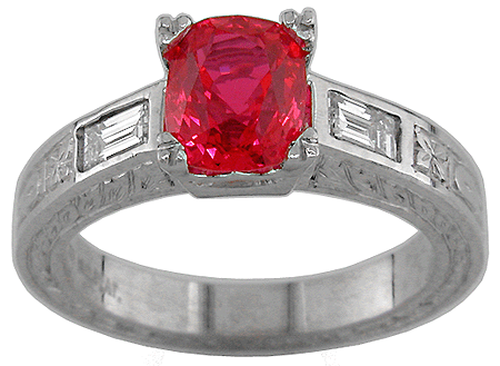 Platinum ring with flame red spinel and baguette diamonds.