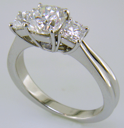 Three Flanders cut diamonds in a custom platinum ring.