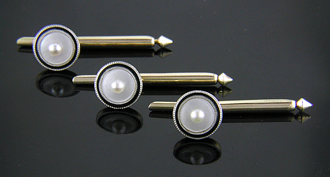 L.E. Garrigus mother-of-pearl and black enamel dress set. (J8735)