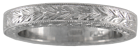 Hand engraved man's wedding band crafted in platinum.