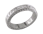 Hand engraved man's wedding band crafted in platinum.