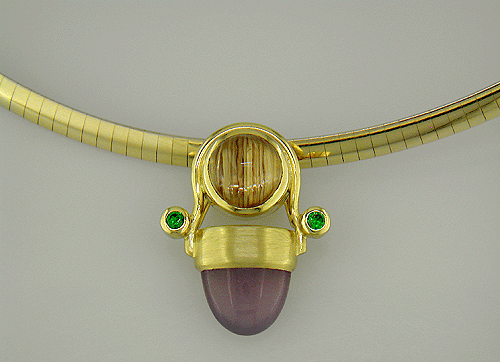 18kt gold pendant featuring holly chalcedony, rutilated quartz and tsavorite garnets.