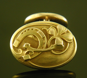 Larter Art Nouveau lucky cufflinks crafted in 14kt gold. (9190)