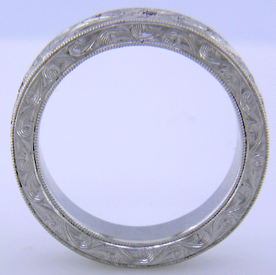 Side view of hand-engraved platinum band set with Lavender Sapphires.