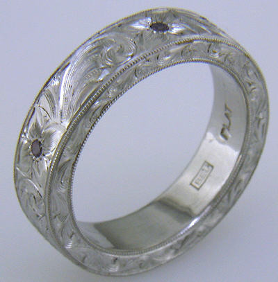 Close up of Bijoux Extraordinaire hallmark, 'BEL'.