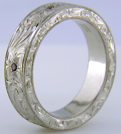 Hand engraved platinum band set with Lavender Sapphires.