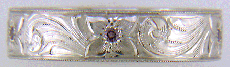 Hand engraved platinum band set with Lavender Sapphires.