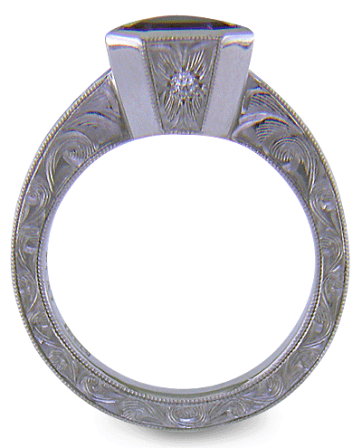 Hand engraved platinum ring with a shield-shape Lavender Spinel. (J8710)