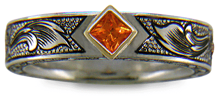 A beautifully hand-engraved ring set with fiery orange Manderin Garnets. (J8703)