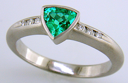 Trillium Paraiba tourmaline accented with diamonds in a custom platinum ring.