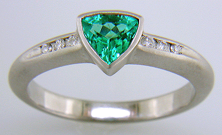 Trillium Paraiba tourmaline accented with diamonds in a custom platinum ring.