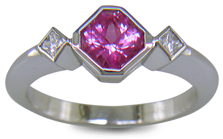 Pink Sapphire set with two Princess-cut diamonds in a platinum ring. (J8547)