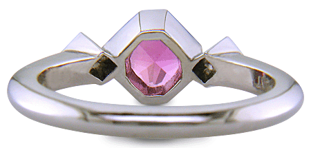 Pink Sapphire set with two Princess-cut diamonds in a platinum ring. (J8547)