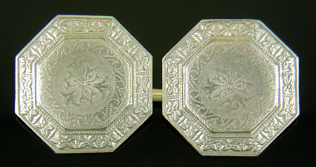Elegantly engraved platinum and gold cufflinks. (J9333)