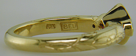 Close-up fo Bijoux Extraordinaire hallmark (BEL).